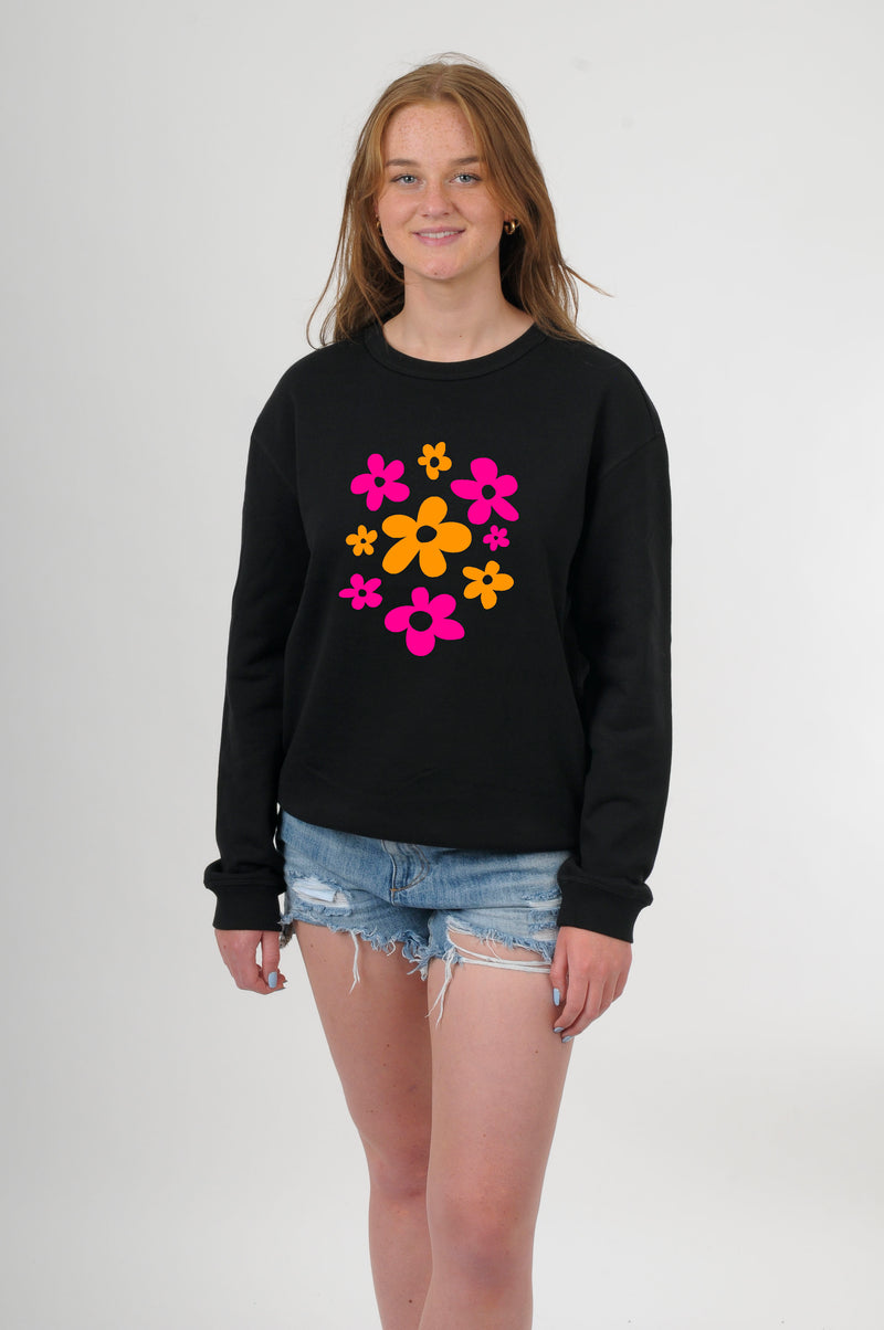 A Women wearing a Black cotton crew Sweater with Orange and Hot Pink floral print